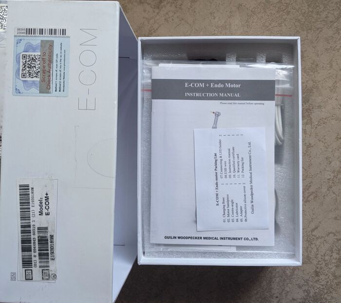 Эндомотор Woodpecker E-Com+ плотностью в рабочем состоянии. Zooble.com.ua